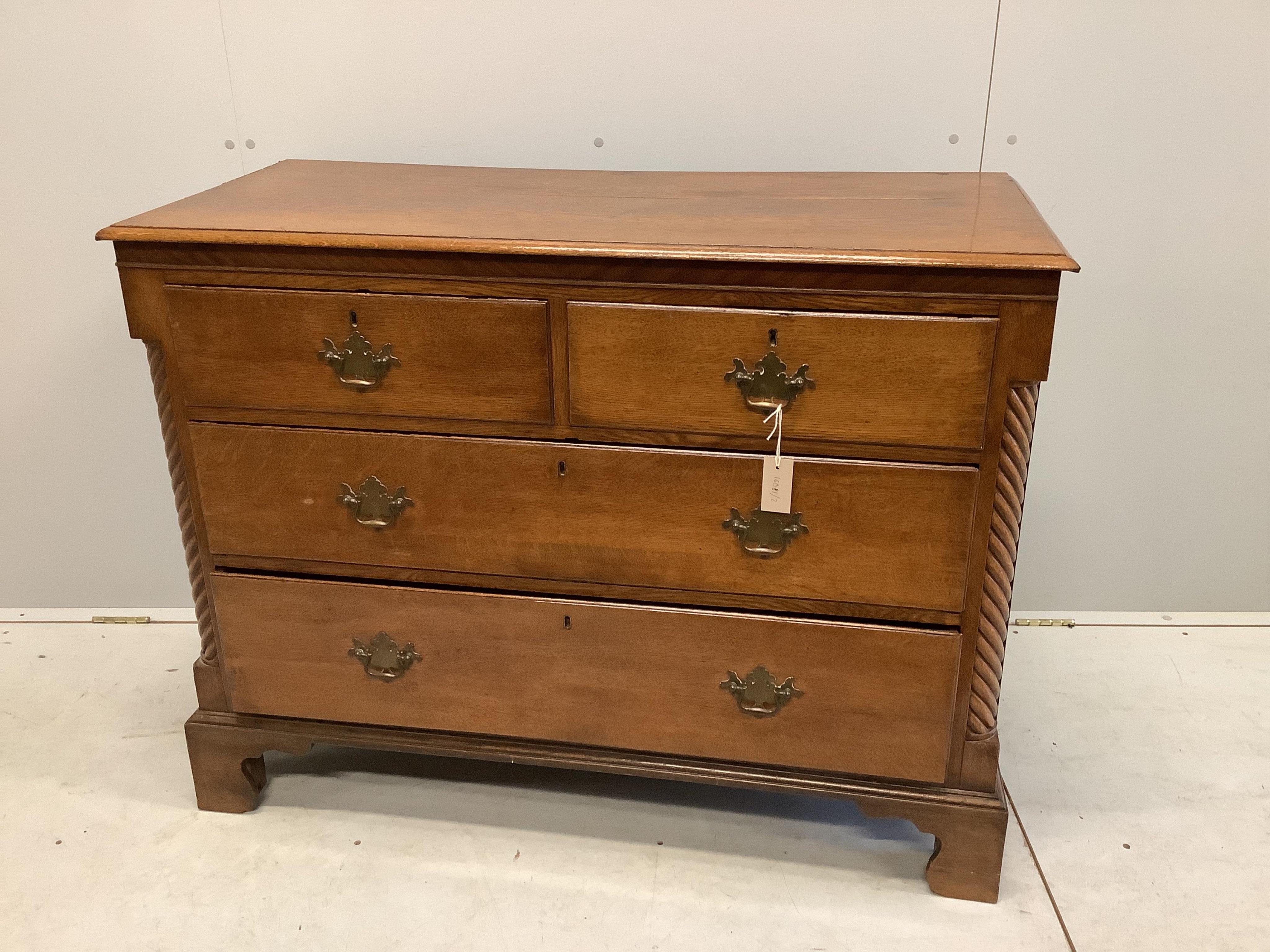 A George III oak four drawer chest, width 114cm, depth 51cm, height 88cm. Condition - fair